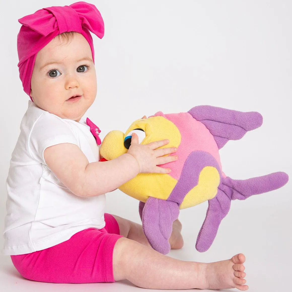 Berrettino in jersey fucsia da bambina