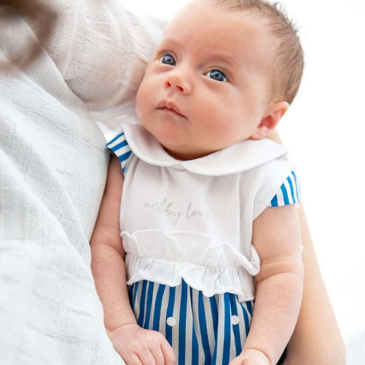 Pagliaccetto in jersey e tela da neonata