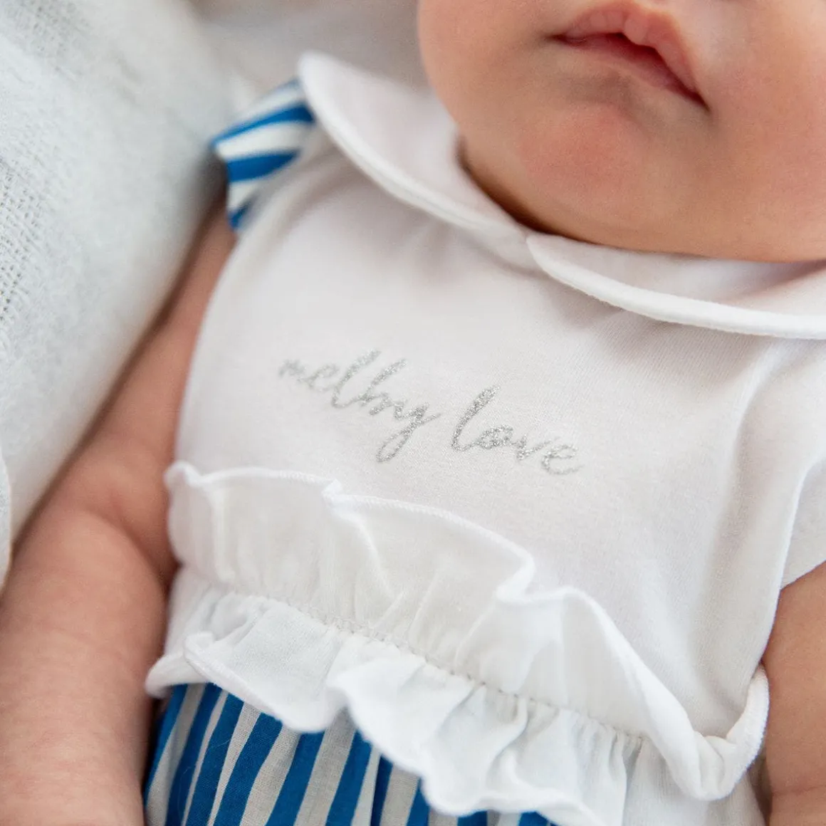 Pagliaccetto in jersey e tela da neonata